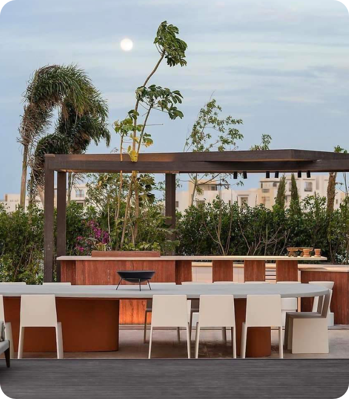 Outdoor majlis seating area with wooden pergola and built-in bench