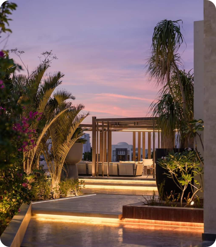 Modern outdoor living space with woven furniture and glass sliding doors
